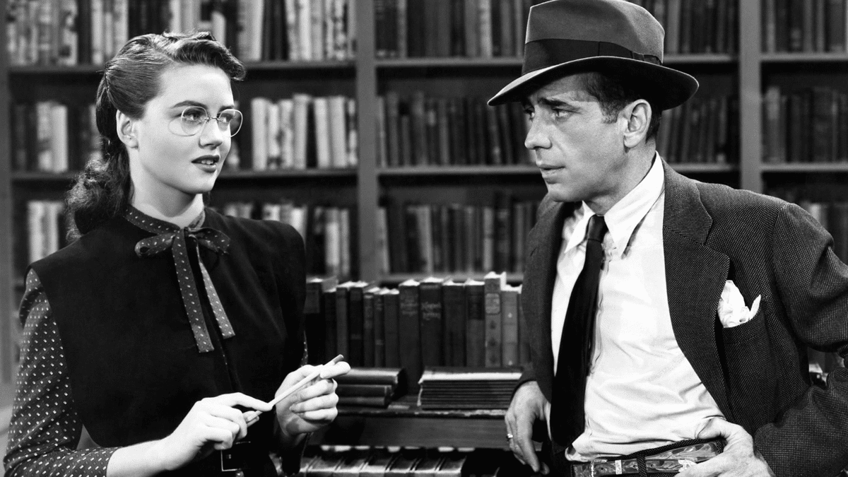 A shot from the 1946 film "The Big Sleep" starring Humphrey Bogart. In this scene, quintissential noir detective Phillip Marlowe (played by Humprey Bogart) visits a library for research purposes.
